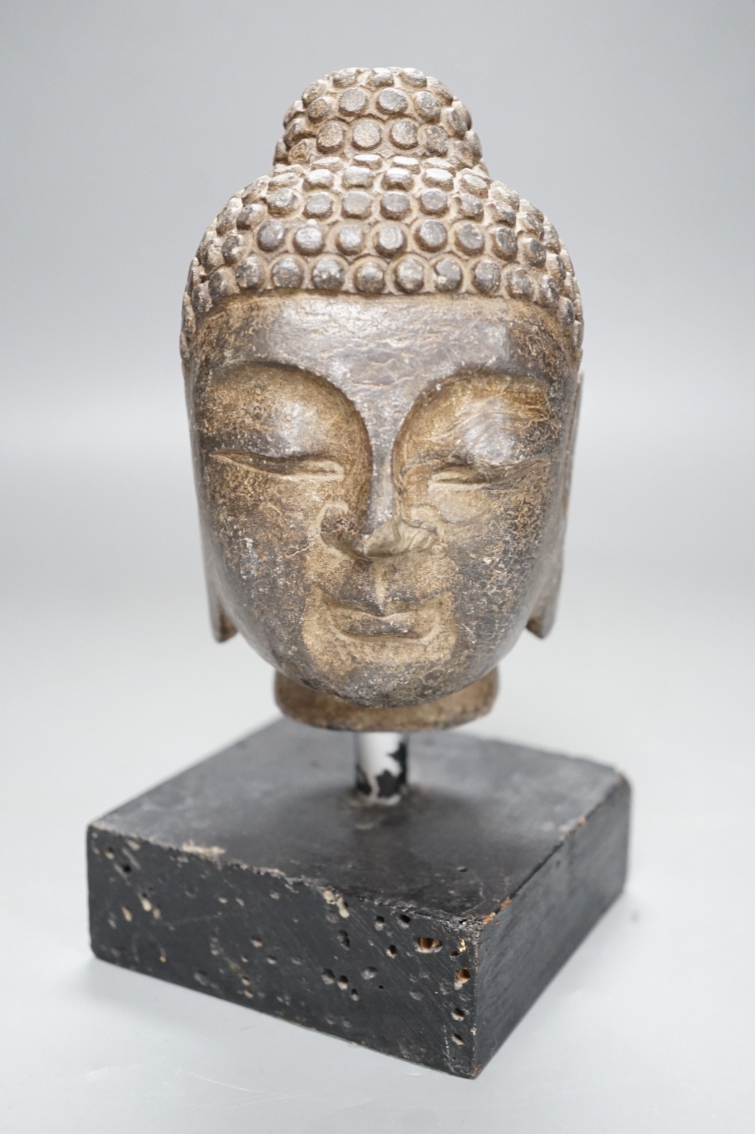 A Chinese stone Buddha’s head on stand 19cm total height